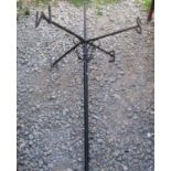 A wrought iron weather vane with simple scroll detail, mounted on a tubular stem/pole, (lacks finial
