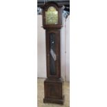 A reproduction mahogany longcase clock with domed hood, painted metal dial, canted and reeded detail