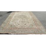 A large country house Meshed carpet with a central medallion and an all over floral pattern in