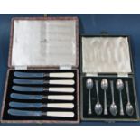 A cased set of six silver teaspoons, six silver collared Walker & Hall butter knives and a silver