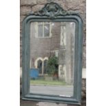 A 19th century style overmantle mirror the moulded framework set beneath aa shaped and pierced