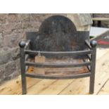 A small iron fire basket with fitted fire back, 45cm wide, 35cm deep