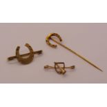 9ct hunting stock pin, 1.1g, together with a gold plated horseshoe stick pin and a further gold