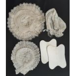 Two Victorian white cotton hats elaborately sculpted with broderie anglais together with a