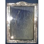A silver photo frame with swag and garland decoration, Birmingham 1908, maker Henry Matthews, 226