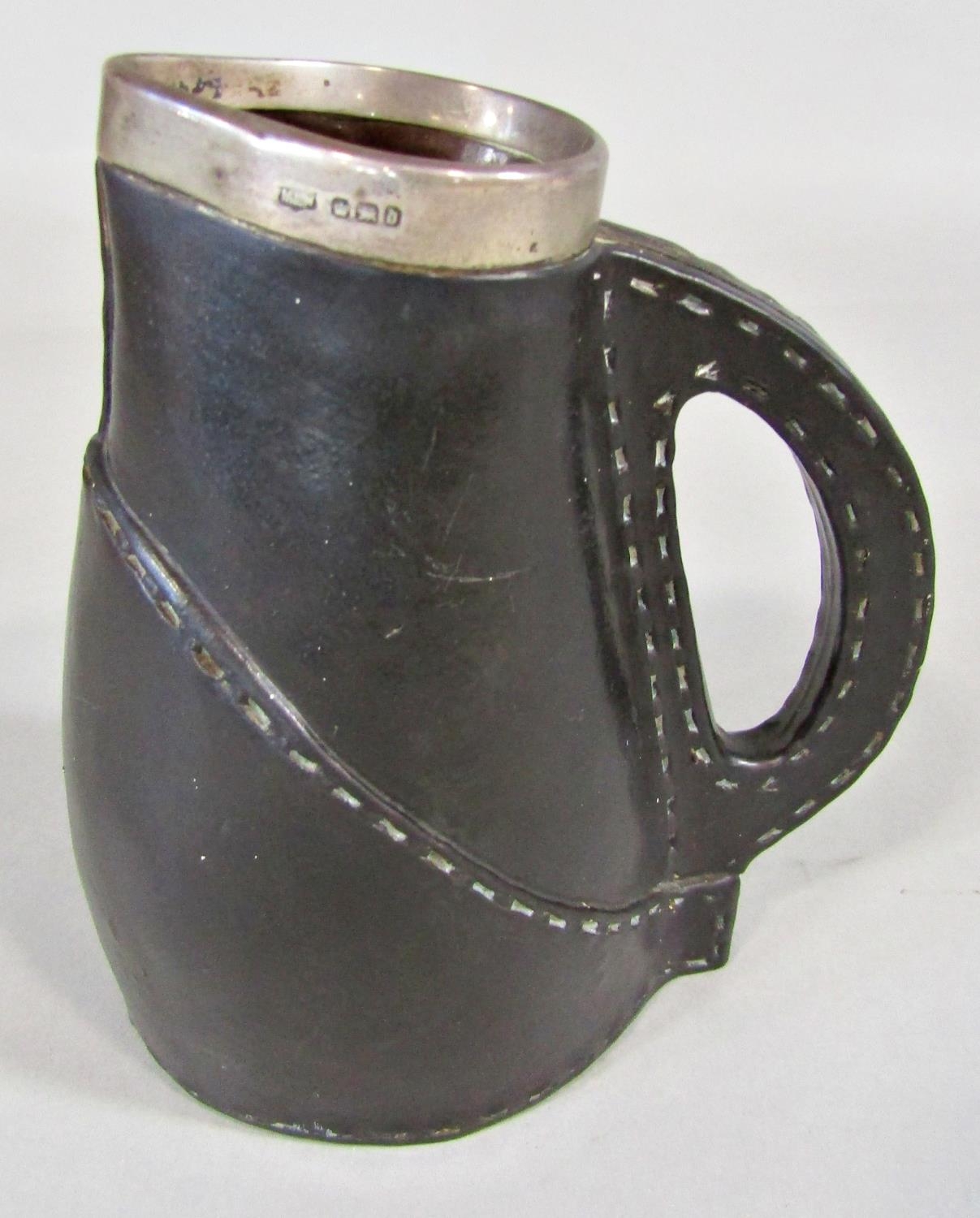 A Doulton Lambeth leatherware jack, with silver mount, Sheffield 1896, 16cm tall approx