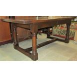 Old English oak refectory table, the heavy planked top with cleated ends, raised on four gun