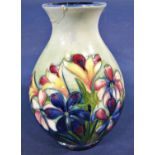 A Moorcroft oviform vase with floral detail, 16cm (af to neck)