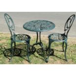 A green painted cast aluminium three piece garden terrace set with decorative pierced and