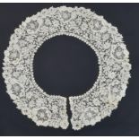 19th century lace bertha/ collar finely worked in a floral design with point de gaze type sections.