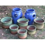 A pair of small contemporary blue glazed strawberry planters 31 cm high together with six mottled