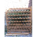 A stripped pine framed floorstanding wine rack to hold 81 bottles, together with a number of empty