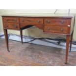 An inlaid Edwardian mahogany ladies writing desk with inset leather top, the central kneehole