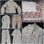 A collection of early to mid 20th century clothing including a high collared starched Edwardian