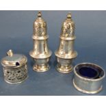 Two similar silver pepper pots, a single napkin ring and a salt pot (glass liner stuck) 6.3oz approx