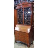 An inlaid Edwardian mahogany bureau bookcase with satinwood crossbanding and further detail, the