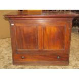 Early 19th century mahogany cabinet enclosing twelve pigeon holes enclosed by a panelled up-and-over