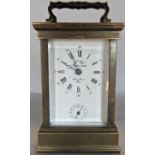 A French L’ Epee carriage clock with brass casework and enamelled dial, with eight day time piece