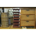 A pair of low stained pine framed chests, each enclosing three wicker drawers, together with a small