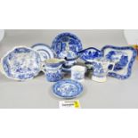 A collection of 19th century and later blue and white transfer ware, cups, dishes, mugs, tureen