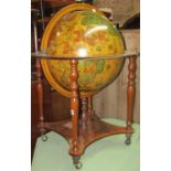 A drinks cabinet in the form of a reproduction terrestrial globe and stand with stained beechwood