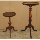 A small 1920s oval drop leaf occasional table with pie crust border raised on slender barley twist