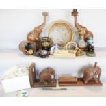A box of items including a pair of wooden elephant table lamps, a Damascus style inlaid wooden tray,