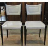 A pair of E Gomme early G plan dining/side chairs with cream coloured faux leather upholstered