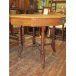 A Victorian mahogany centre table of octagonal form, with alternating real and dummy drawers, raised