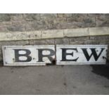 A vintage enamel sign of rectangular form in two sections, cream ground with black lettering 'Brew',