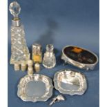 A mixed selection of silver consisting of five thimbles, two ashtrays, a tortoiseshell trinket