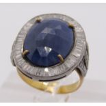 Bi-colour metal sapphire and diamond cluster dress ring, set with a large faceted opaque sapphire