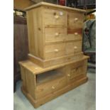 A small stripped pine chest fitted with a side by side arrangement of six drawers set on a moulded