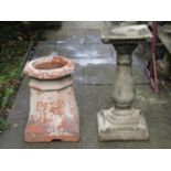 A weathered cast composition stone sundial pedestal of baluster form with scroll detail and square