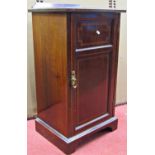 An inlaid Edwardian mahogany side table fitted with two frieze drawers and cupboard, raised on