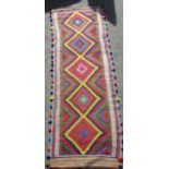 An old Sunni flat weave runner with brightly coloured panels, 320cm x 82cm approx