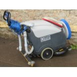 A Nilfisk CA1410 industrial floor polisher