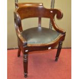 A mid-19th century mahogany office or library chair, the horseshoe shaped back raised on swept