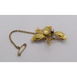 Arts & Crafts 15ct mistletoe brooch set with a diamond and a pearl, 3.6g