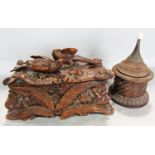 A 19th century heavily carved wooden box with pheasants amongst woodland to the lid,(as found,