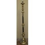 A lamp standard in a black and gilded colourway