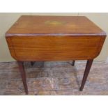 A Georgian mahogany Pembroke table raised on square tapered legs, the top with inlaid oval panel