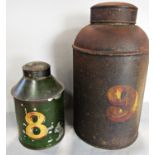 A green painted tin tea canister and another larger plain canister.