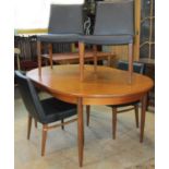 A G plan teak D end pull-out extending dining table with single additional bi-folding leaf raised on