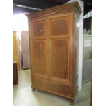 An inlaid Edwardian mahogany wardrobe with satinwood crossbanding, boxwood and ebony stringing,