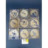 A collection of 28 18th century Dutch Delft tiles, hand painted in blue and white, each depicting an