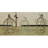 A quantity of contemporary small hanging bird cage tealights with bird finials