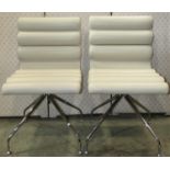 A pair of Frag 828 swivel chairs with cream stitched leather rolled/contoured upholstery, raised