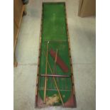 A Victorian mahogany foldover pool table, baise lined and with cues