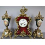 A reproduction clock garniture in the French manner, the clock case with simulated tortoiseshell